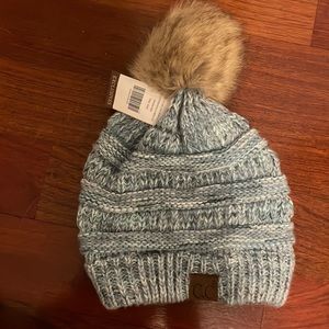 C.C blue knit hat with faux fur Pom